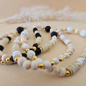 Handmade phone jewelry made from white or black natural pearls