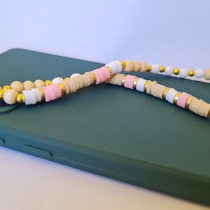 Handmade phone jewelry made from natural pearls and pink heishi pearls