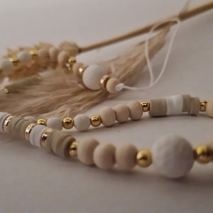 Handmade phone jewelry made from natural white or black pearls