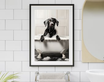 May include: A black and white dog sits in a white bathtub filled with bubbles. The dog is looking at the camera with a wet, soapy face. The bathtub is on a black and white tiled floor. The image is framed in a black frame.
