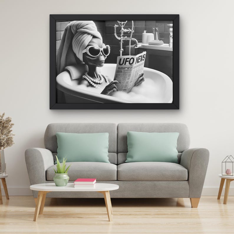 May include: A black and white photo of an alien in a bathtub reading a newspaper that says "UFO NEWS". The alien is wearing a towel on their head and sunglasses.
