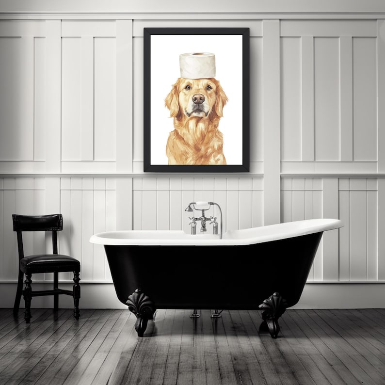 May include: A black and white bathroom with a black clawfoot tub and a framed print of a golden retriever wearing a toilet paper roll on its head.