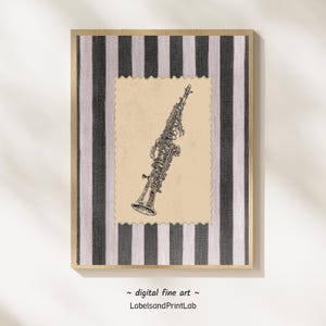 May include: A framed print featuring a detailed black and white illustration of a saxophone. The artwork is set against a beige background with a decorative border, framed by a striped pattern in black and white. The text "digital fine art" and "LabelsandPrintLab" are at the bottom.