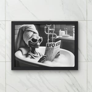 May include: A black and white photo of an alien in a bathtub reading a newspaper titled "UFO News". The alien is wearing sunglasses and a towel on their head.