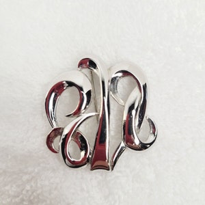 Vintage MONET Silvertone Swirl Brooch Simple Elegant Signed