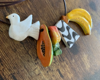 Glazed Ceramic Charm: Handmade Glossy Clay Piece
