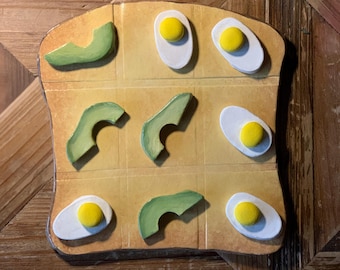 Ceramic Tic Tac Toe Game: Avocado vs. Egg on Toast - Art Center Piece