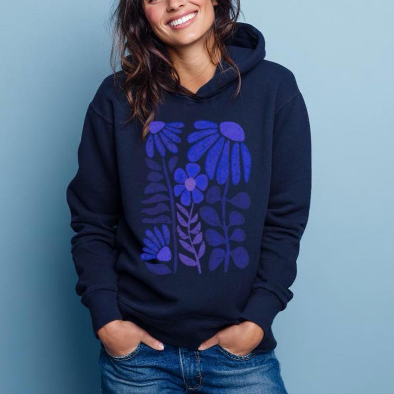 May include: A navy blue hooded sweatshirt featuring a graphic print of stylized flowers and leaves in shades of blue and purple. The hoodie has long sleeves, a front kangaroo pocket, and a hood with drawstrings, providing a casual look.