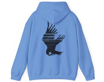 May include: A light blue hoodie with a black graphic of a bird in flight on the back.