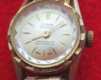 Reloj Sorna Swiss Made para mujer, bicolor, con 17 joyas: corte de diamante, antimagnético e impermeable.