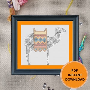 May include: A cross stitch pattern featuring a camel with a colorful patterned saddle. The pattern is in a black frame with an orange mat. The image includes the text "PDF INSTANT DOWNLOAD".
