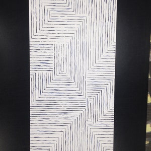 May include: White wallpaper with a geometric pattern of blue lines forming squares and rectangles.