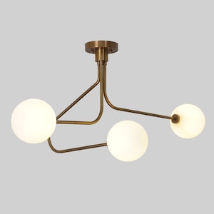 A Stilnovo Ceiling Light with Three Brass Framed Disks A Stilnovo Ceiling Light with Three Brass Framed Disks