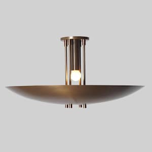 May include: A brass ceiling light fixture with a circular, saucer-shaped shade and a central column with multiple vertical rods.