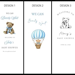 May include: Three vertical rectangular baby shower sign designs on a white background. Design 1 features a brown teddy bear with a blue bow, text reading WE CAN Bearly Wait, WELCOME TO July's BABY SHOWER, and We're so glad you're here. Design 2 shows a blue and white hot air balloon with a teddy bear, and text WE CAN Bearly Wait. Design 3 displays a black and white teddy bear illustration with text WELCOME TO Mary's BABY SHOWER and JUNE 20, 2026.