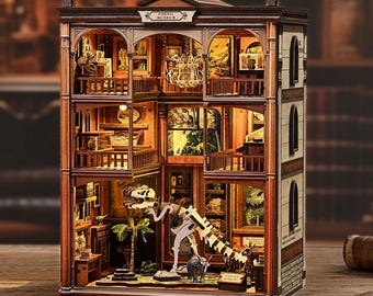 May include: A detailed wooden model of a museum, featuring multiple floors with exhibits, balconies, and a sign that reads "Fossil Museum." The interior is lit, showcasing dinosaur skeletons and other artifacts.