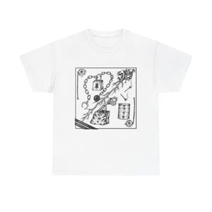May include: White t-shirt featuring a detailed black and white graphic. The design includes a chain, lock, eye, and other symbolic elements within a square frame. The text "RANTUA STRANGER" is also present.