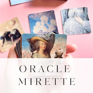 May include: A deck of square oracle cards titled ORACLE MIRETTE, featuring a central card with a portrait of a person in a wide-brimmed hat, surrounded by other cards displaying artistic illustrations of clouds, stars, and figures.
