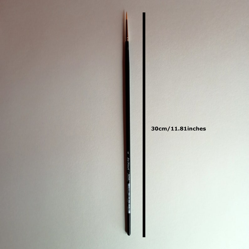 May include: A black paint brush with a gold tip, measuring 11.81 inches or 30 cm in length.