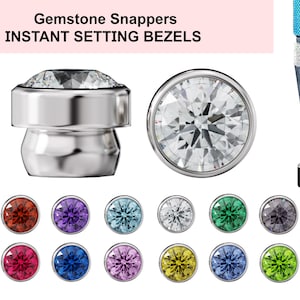 May include: Gemstone Snappers Instant Setting Bezels, a set of 12 colorful gemstone bezels in various colors, including red, blue, green, purple, and yellow. The bezels are designed to be used with a setting tool, which is also pictured.