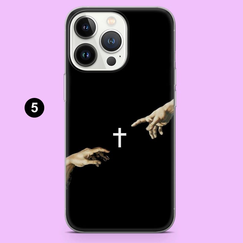 May include: Black phone case with a white cross and two hands reaching towards each other.