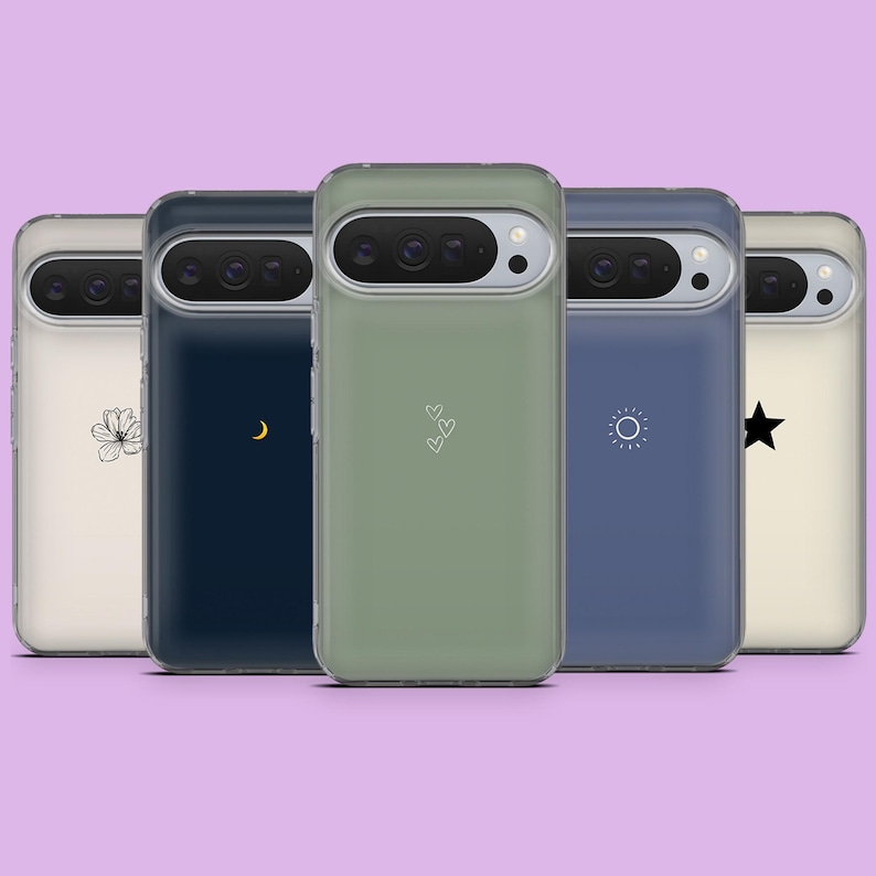 May include: A collection of five phone cases in various colors, each featuring a different minimalist design. The cases are in shades of cream, navy, olive green, blue, and beige, with designs including a flower, crescent moon, hearts, sun, and star.