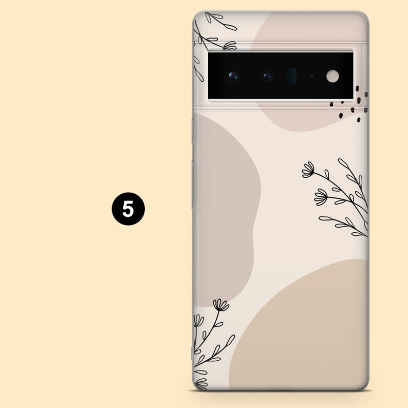 May include: A clear phone case with a beige background and abstract shapes. The case has a black line drawing of flowers and leaves.