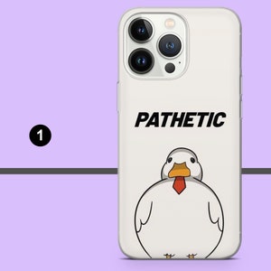 May include: A white iPhone case with a cartoon duck wearing a red tie and the word "PATHETIC" printed on it.