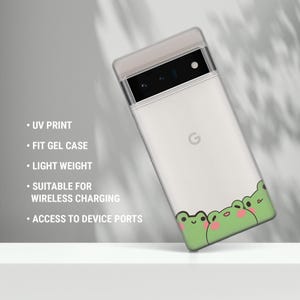 May include: A white phone case with a green frog design. The case is made of gel and has a UV print. It is compatible with wireless charging and has access to device ports.
