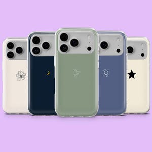 May include: Five phone cases with different designs. The cases have a clear border and a light gray top. The designs include a flower, a crescent moon, three hearts, a sun, and a star. The background is a light purple.