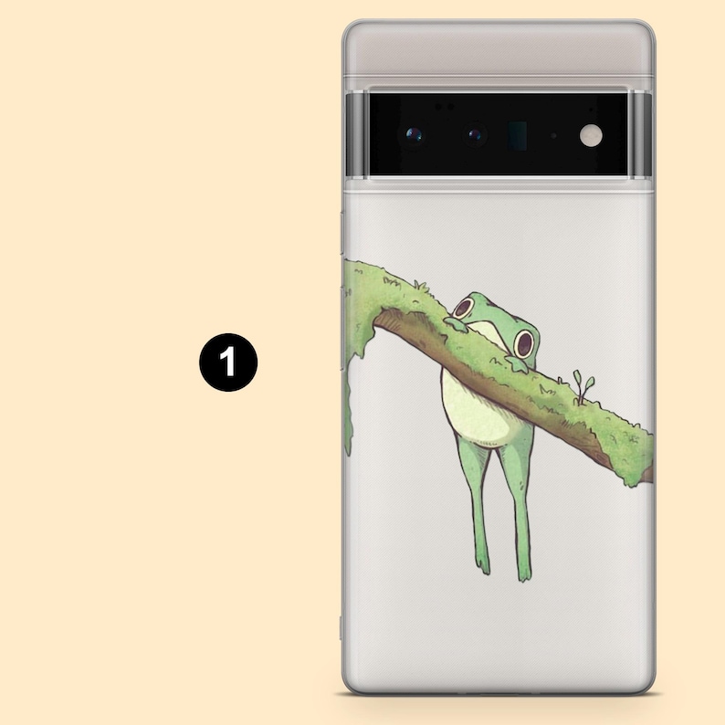 May include: A white phone case with a green frog hanging from a branch. The frog is holding onto the branch with its feet and has its eyes closed. The branch is covered in green moss.