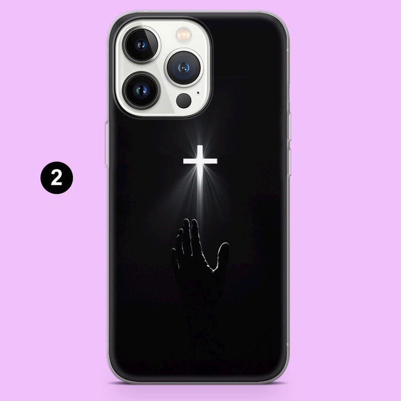 May include: A black phone case with a white cross and a hand reaching up towards it. The cross is glowing with a white light.