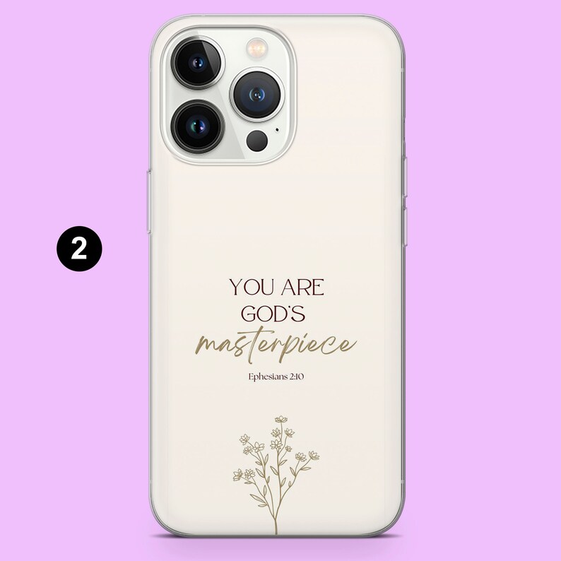 May include: White phone case with a gold design that says "You are God's masterpiece" and "Ephesians 2:10". The design also includes a small floral illustration.