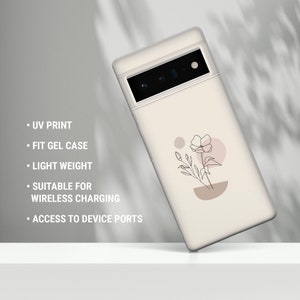 May include: A white phone case with a minimalist floral design. The case is made of a soft gel material and has a UV printed design. It is compatible with wireless charging and has access to all ports.