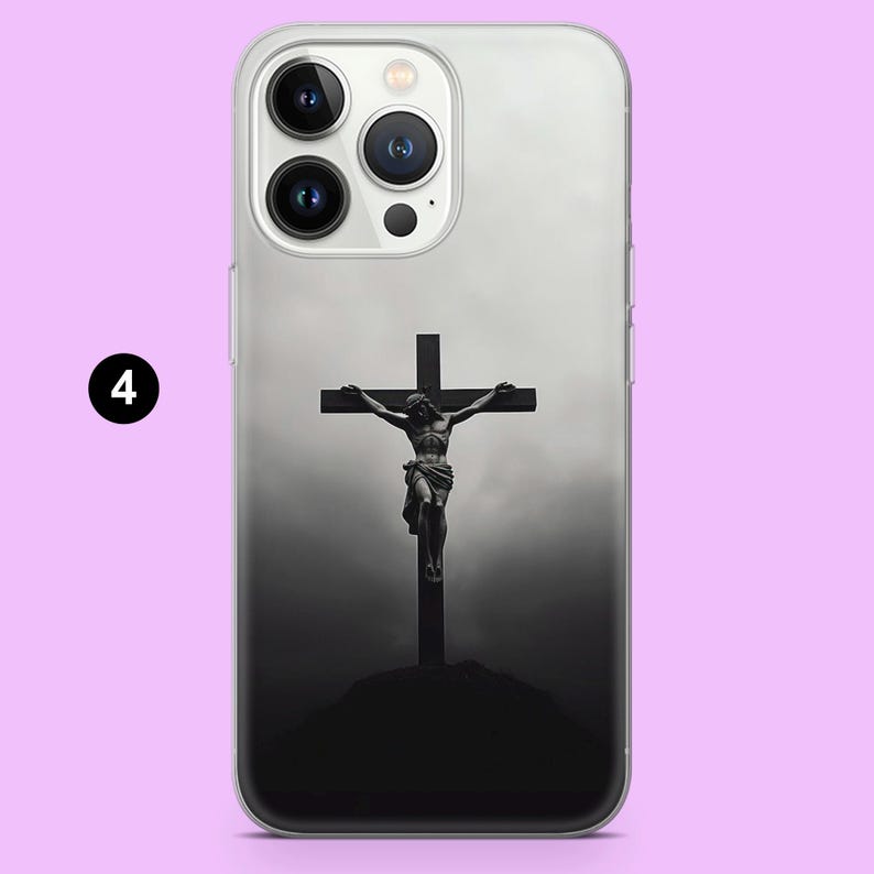 May include: A black and white phone case with a design of a person on a cross. The phone case is clear and has a white border.