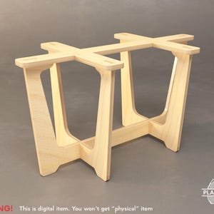 May include: A wooden table base with a simple, modern design. The base is made of plywood and has a natural wood finish.