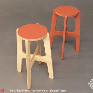 May include: Two wooden stools with a simple design. The stools are made of natural wood and have a light brown finish. The top of each stool is painted a bright orange colour.