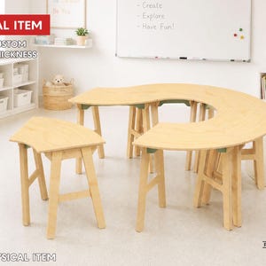 May include: A light-colored wooden table set consisting of a large curved desk and a smaller matching side table, both featuring sturdy legs with green accents. The image includes text stating DIGITAL ITEM, FREE CUSTOM SIZE & THICKNESS.
