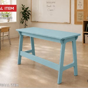 May include: A light blue rectangular table with a flat top and A-frame legs. The image includes text stating DIGITAL ITEM, FREE CUSTOM SIZE & THICKNESS, and NO PHYSICAL ITEM. The table is positioned in a room with a whiteboard and wooden shelving.