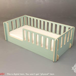 May include: A light green wooden toddler bed with a mattress. The bed frame has vertical slats on the sides and a low side rail. The text "WARNING! This is digital item. You won't get "physical" item" is at the bottom.