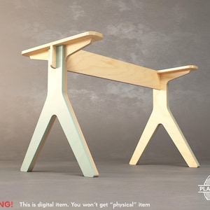 May include: A wooden table base with a light green and natural wood finish. The base is shaped like a triangle with three legs. The table base is designed for a desk or table top.