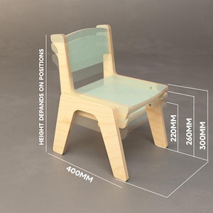 May include: A light-coloured wooden chair with a transparent back and seat. The chair's height depends on the position, with options of 22cm, 26cm, and 30cm. The chair is 40cm wide.