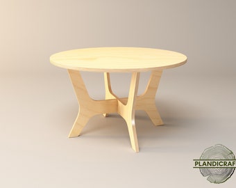 Può includere: Un tavolino da caffè rotondo in legno con un design semplice e moderno. Il tavolino ha una finitura in legno chiaro e quattro gambe a forma di croce.