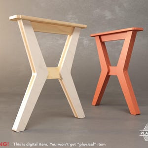 May include: Two wooden table legs, one white and one orange, are shown against a gray background. The legs are in an X shape and have a simple design.