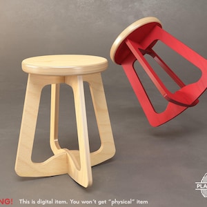 May include: A wooden stool with a triangular base and a red painted version of the stool flipped upside down. The stool is made of plywood and has a natural wood finish.