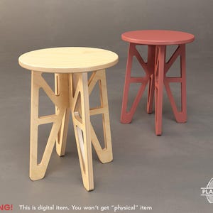May include: Two wooden stools with circular seats and geometric leg structures. One is natural wood, the other is painted a dusty rose colour. The stools are set against a grey backdrop. The text "WARNING! This is digital item. You won't get "physical" item" is at the bottom.