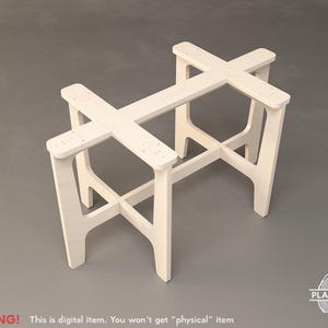 May include: A white wooden table base with an X-shaped design. The base is made of several rectangular pieces of wood joined together. The legs are angled and connected by a cross-shaped support. The text "WARNING! This is digital item. You won't get "physical" item" is at the bottom.
