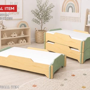 May include: A digital item listing for a low-profile wooden floor bed frame with a natural light wood finish and sage green accents. The design features a rectangular base with a white mattress surface. Text reads DIGITAL ITEM and NO PHYSICAL ITEM.
