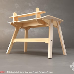 May include: A light-colored wooden desk with a two-tiered design. The desk features a top shelf, a main work surface, and angled legs. The text "WARNING! This is digital item. You won't get "physical" item" is visible at the bottom.