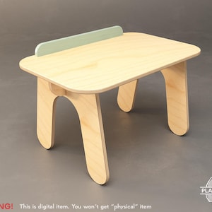 May include: A small, light-colored wooden table with a rectangular top and curved legs. A light green accent piece is attached to the back of the table. The table is designed for children's use. The text "WARNING! This is digital item. You won't get "physical" item" is at the bottom.